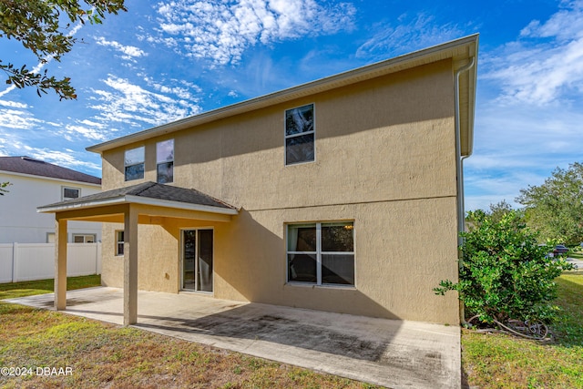 back of property featuring a patio area