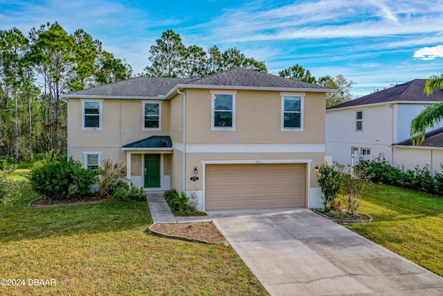 view of front property featuring a front yard and a garage