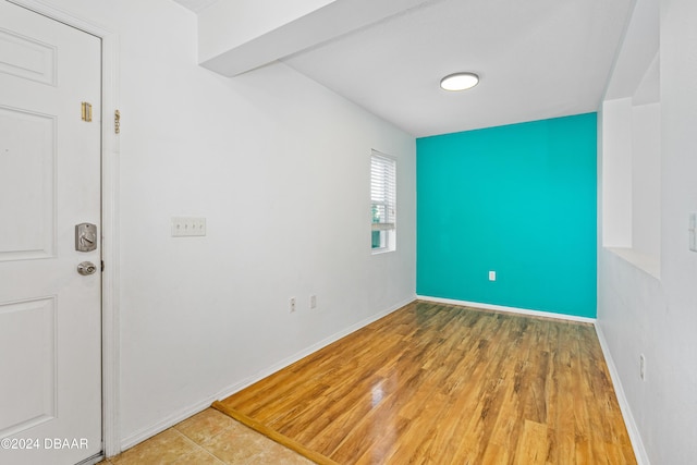 empty room with hardwood / wood-style floors