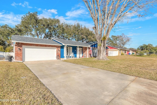 ranch-style home with a garage and a front lawn