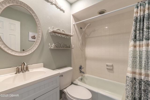 full bathroom featuring vanity, shower / bathtub combination with curtain, and toilet