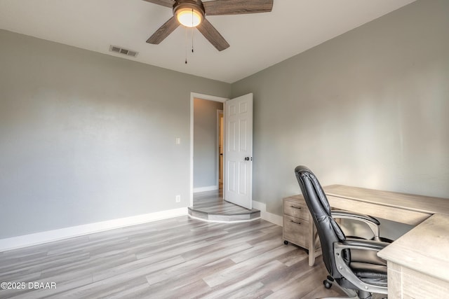 office area with ceiling fan and light hardwood / wood-style floors