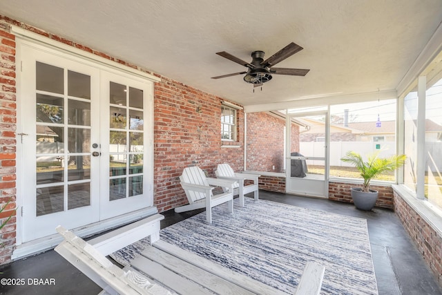 sunroom with ceiling fan and french doors