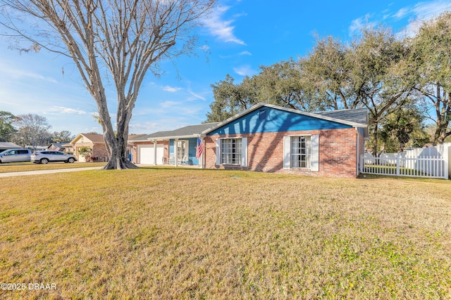 single story home with a garage and a front lawn