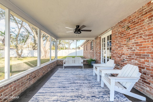 exterior space with ceiling fan