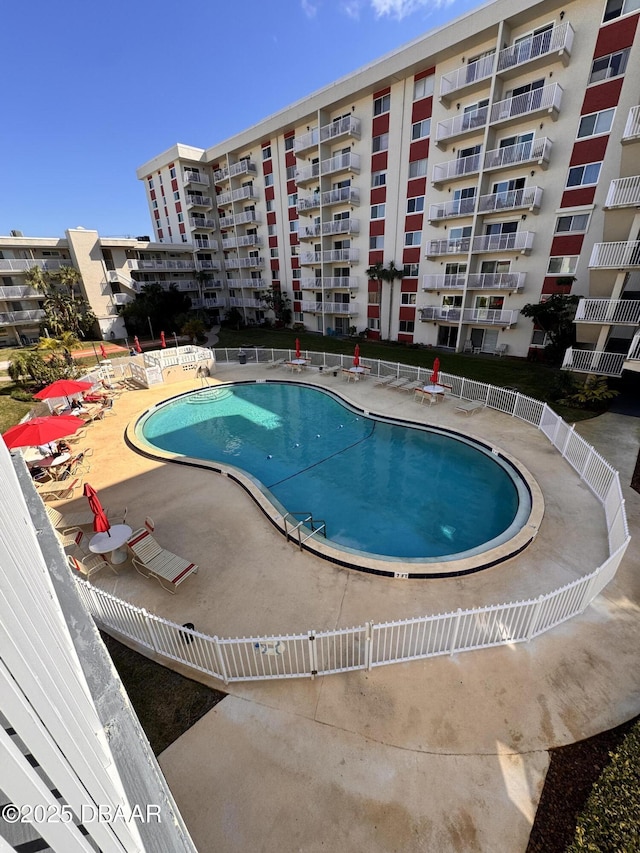 view of pool featuring a patio