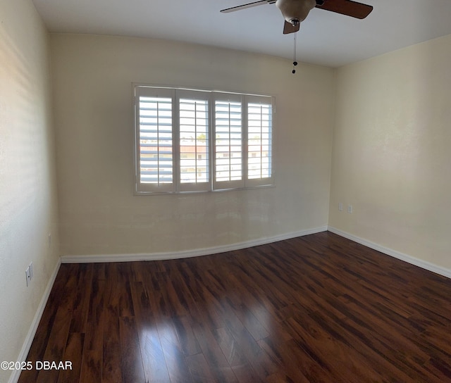 unfurnished room with ceiling fan and dark hardwood / wood-style flooring