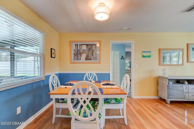 948 Northbrook Dr, Ormond Beach, FL 32174 - dining room with wood finished floors and a textured ceiling