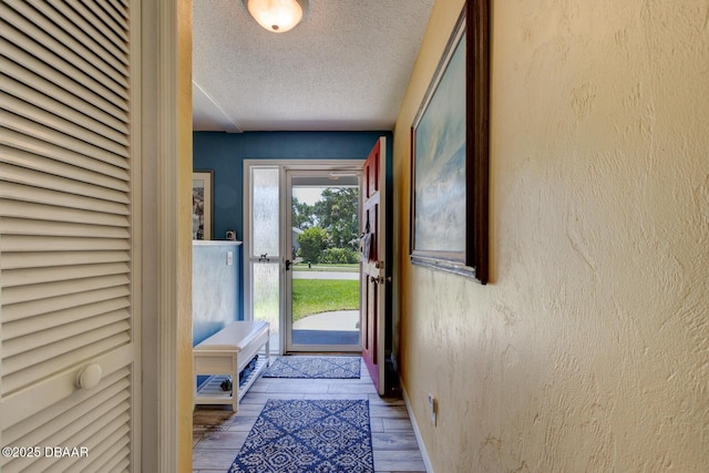 948 Northbrook Dr, Ormond Beach, FL 32174 - doorway featuring a textured ceiling and wood finished floors