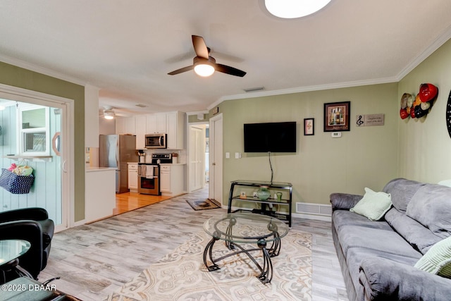948 Northbrook Dr, Ormond Beach, FL 32174 - living area with ceiling fan, light wood-style floors, and crown molding