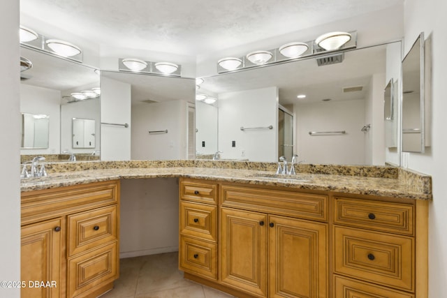 3003 S Atlantic Ave Unit 16B3, Daytona Beach Shores, FL 32118 - full bath with vanity, a stall shower, and tile patterned flooring