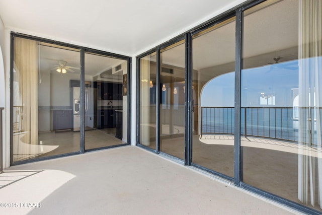 3003 S Atlantic Ave Unit 16B3, Daytona Beach Shores, FL 32118 - unfurnished sunroom with a ceiling fan