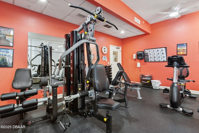 3003 S Atlantic Ave Unit 16B3, Daytona Beach Shores, FL 32118 - gym featuring ceiling fan, a drop ceiling, and baseboards