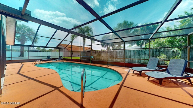 view of pool featuring a lanai and a patio