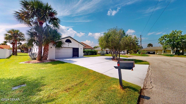 view of front facade with a garage and a front lawn