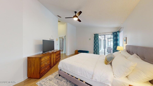 bedroom with access to outside, vaulted ceiling, ceiling fan, and light wood-type flooring