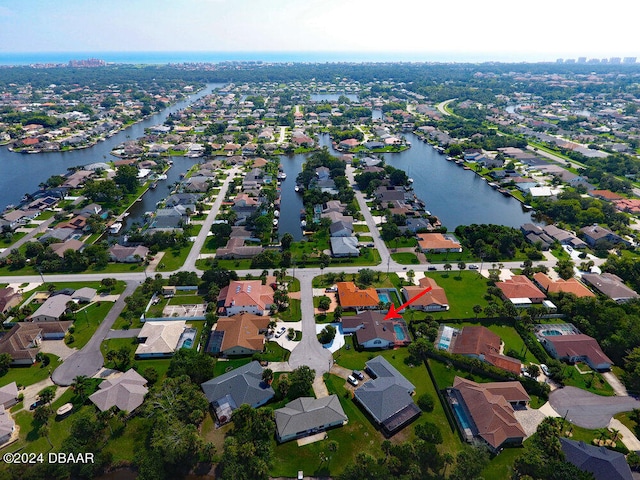 drone / aerial view with a water view