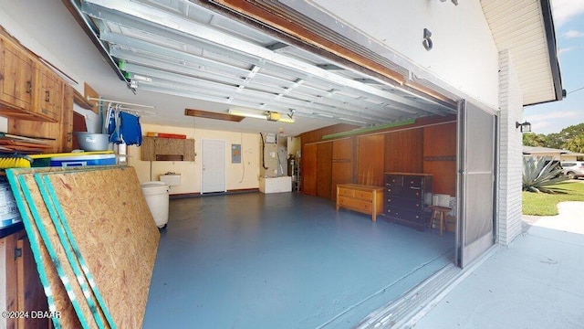 garage featuring a garage door opener and electric panel