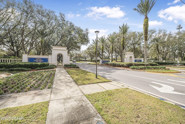 view of street with curbs, street lighting, and sidewalks