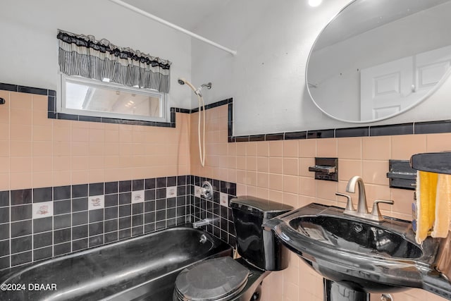 801 E 24th Ave, New Smyrna Beach, FL 32169 - bathroom featuring washtub / shower combination, a sink, toilet, and tile walls