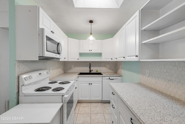 801 E 24th Ave, New Smyrna Beach, FL 32169 - kitchen featuring white appliances, a sink, open shelves, and tasteful backsplash