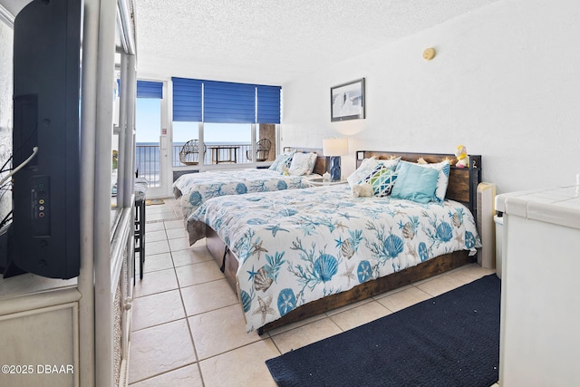 3501 S Atlantic Ave Unit 5200, Daytona Beach, FL 32118 - bedroom featuring tile patterned flooring and a textured ceiling