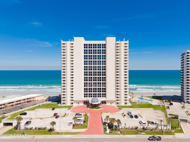 exterior space featuring a view of the beach and a water view