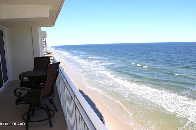 balcony with a view of the beach and a water view