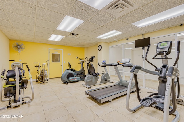 workout area featuring a paneled ceiling