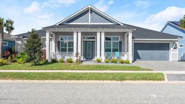 view of front of house with a garage and covered porch