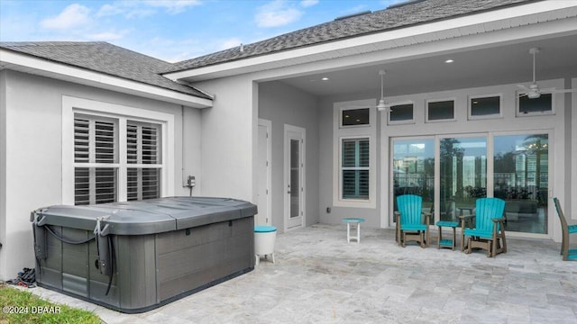 view of patio with a hot tub and ceiling fan