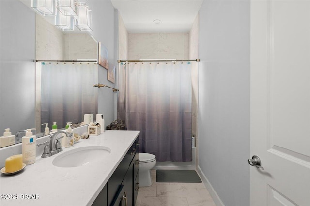 full bathroom with vanity, shower / bath combo with shower curtain, and toilet