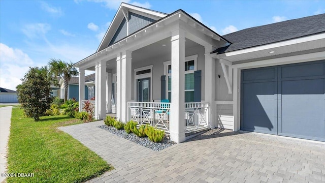 view of property exterior featuring a garage, covered porch, and a yard