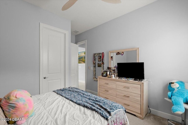 bedroom with ceiling fan and light colored carpet