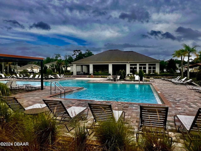 view of swimming pool with a patio area