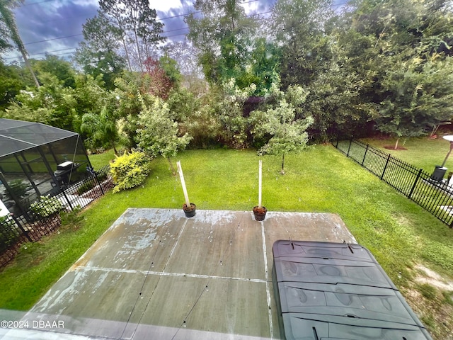 view of yard with a lanai