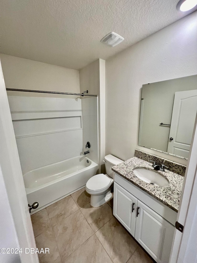 full bathroom with a textured ceiling, vanity, shower / bathing tub combination, tile patterned floors, and toilet