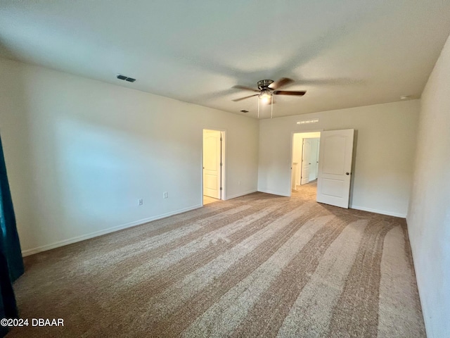 unfurnished bedroom with light colored carpet and ceiling fan