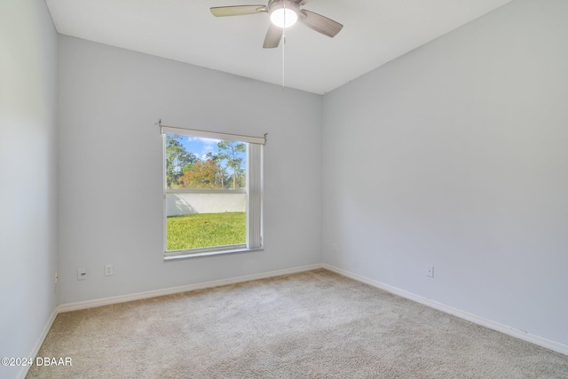 unfurnished room with ceiling fan and carpet floors