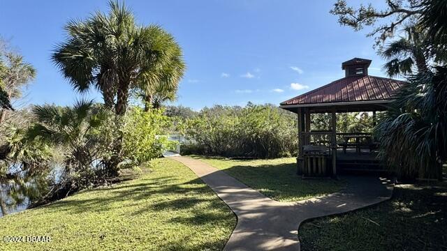5976 Sawgrass Point Dr, Port Orange, FL 32128 - surrounding community featuring a lawn and a gazebo