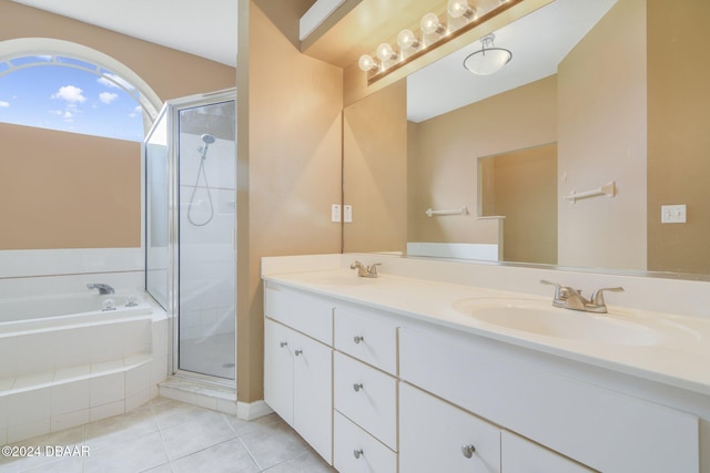 bathroom with tile patterned flooring, vanity, and separate shower and tub