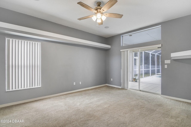 5976 Sawgrass Point Dr, Port Orange, FL 32128 - carpeted empty room featuring a ceiling fan and baseboards