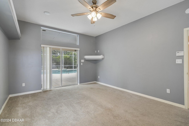 carpeted empty room with ceiling fan