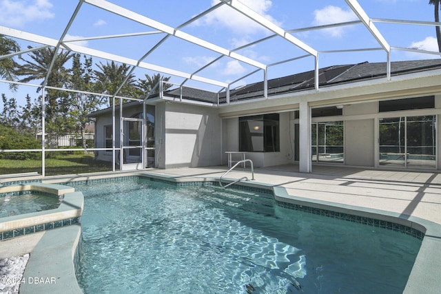 5976 Sawgrass Point Dr, Port Orange, FL 32128 - view of swimming pool featuring a patio, a lanai, and a pool with connected hot tub