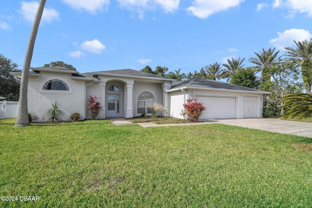 5976 Sawgrass Point Dr, Port Orange, FL 32128 - view of front of home with stucco siding, driveway, and a garage