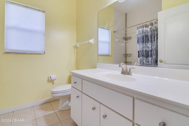 bathroom with tile patterned floors, vanity, curtained shower, and toilet