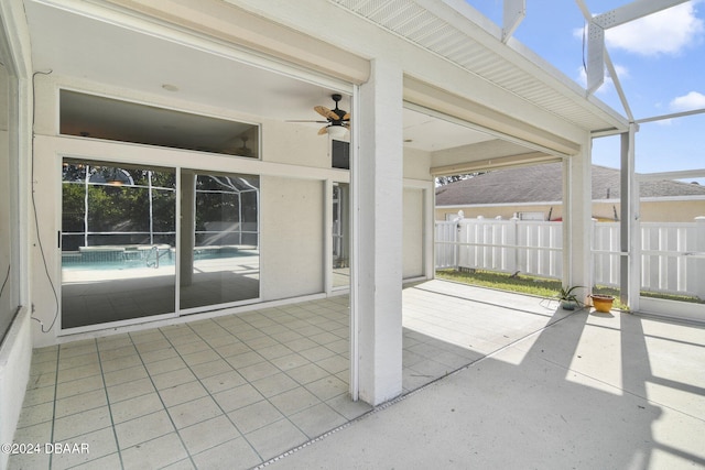 view of patio / terrace with a lanai and ceiling fan