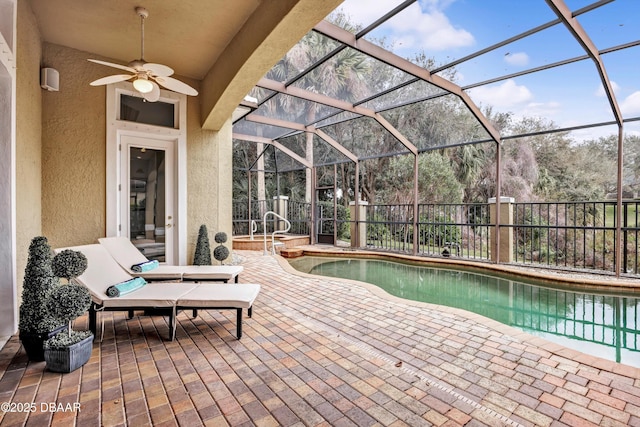 view of pool featuring ceiling fan, a patio, a lanai, fence, and a fenced in pool