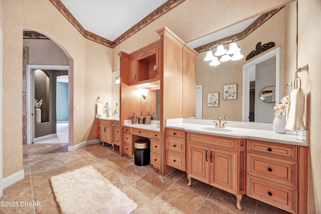 bathroom featuring vanity and baseboards