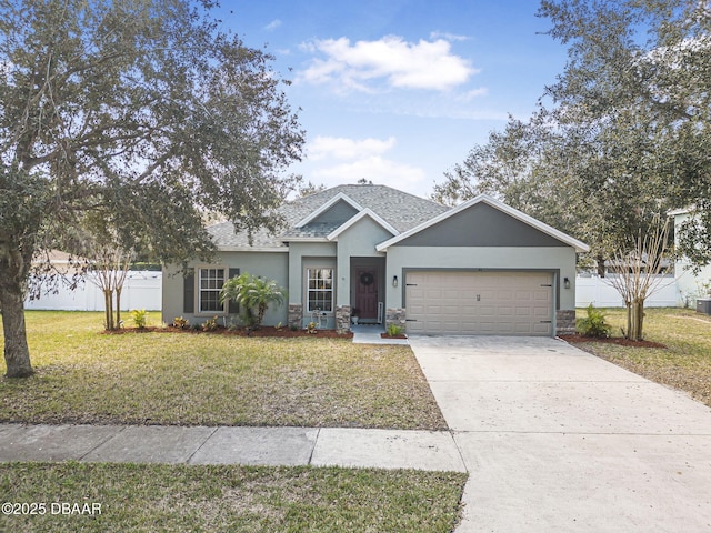 view of front of home with central AC unit, a garage, and a front lawn